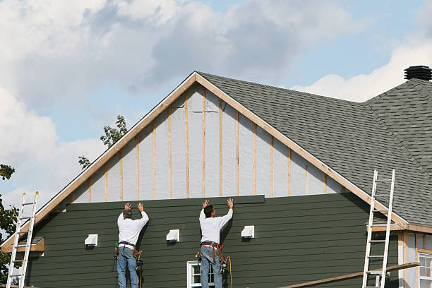 Professional Siding Contractor technician working in Mentcle, PA